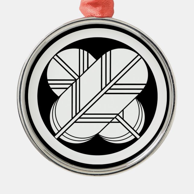 Intersecting hawk feathers with foot in circle metal ornament (Front)