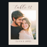 Intimate Beige Minimalist Photo Table Number<br><div class="desc">This wedding table card features a minimalistic and modern design with a warm beige and light brown color palette, creating an intimate and serene atmosphere. The layout includes elegant cursive typography for "table 12" at the top and simple sans-serif text for customization at the bottom, ensuring readability and style. A...</div>