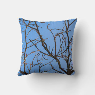 Intricate Bare Branches Silhouette Against Vivid B Throw Pillow