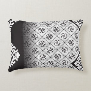 Intricate black and white pattern featuring floral accent pillow