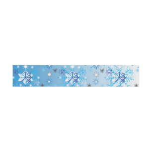 Intricate blue and white stars and snowflakes invitation belly band