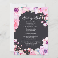 Fleurs roses rousses sur le puits de désir noir