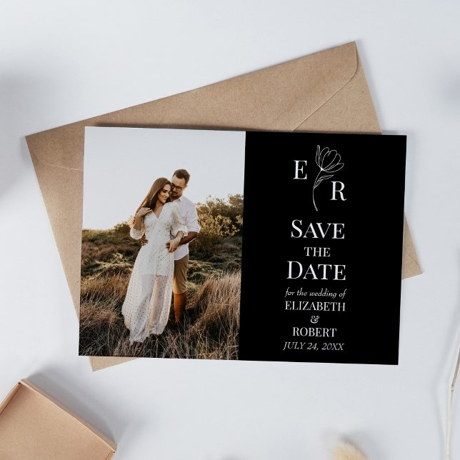 Invitation Monogramme floral noir photo personnalisée Enregis (Black Floral Monogram Custom Photo Save the Date Invitation on white table with dry wildflowers.)