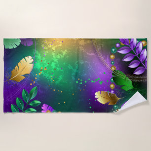 Iridescent mardi gras background with beads beach towel