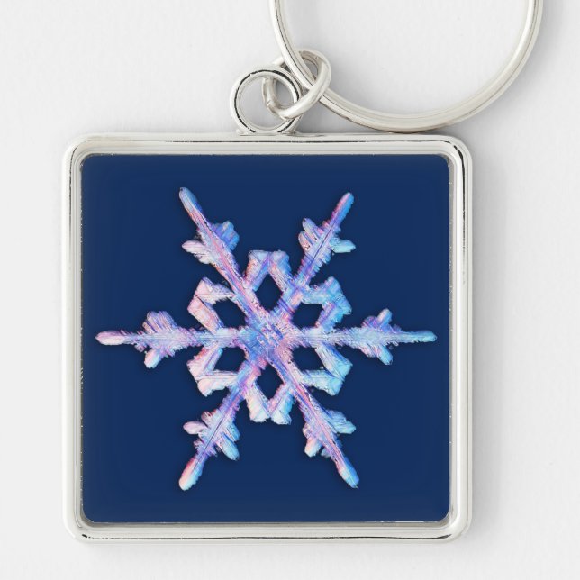 Iridescent snowflake on dark blue keychain (Front)