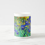 Irises by Vincent Van Gogh Bone China Mug<br><div class="desc">Vincent Van Gogh Irises . Painted in 1889 it is one of the painting he created in Saint Paul-de-Mausole asylum in Saint-Rémy-de-Provence in France. It is an oil painting. This fine art landscape oil painting depicts a field of iris flower plants. Vincent Van Gogh was a famous artist. He was...</div>
