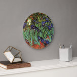 Irises by Vincent van Gogh, Vintage Garden Art Large Clock<br><div class="desc">Irises (1889) by Vincent van Gogh is a vintage fine art post impressionism landscape floral painting featuring a garden with purple bearded irises growing by orange poppies. A single white iris flower is blooming at the edge. About the artist: Vincent Willem van Gogh (1853 -1890) was one of the most...</div>