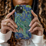 Irises | Vincent van Gogh iPhone 15 Case<br><div class="desc">Irises (1889) by Dutch post-impressionist artist Vincent Van Gogh. Original landscape painting is an oil on canvas showing a garden of blooming iris flowers. 

Use the design tools to add custom text or personalize the image.</div>