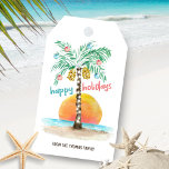Island Holiday Palm Tropical Beach Christmas Gift Tags<br><div class="desc">Tropical beach theme gift tags feature an island in the sun with a palm tree decorated with string lights and ornaments,  a "happy holidays" greeting. and a line of text that you can personalize. Art by KL Stock</div>