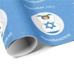 Israeli Flag Hanukkah Angel Personalized Gift Wrapping Paper<br><div class="desc">Design, on personalized gift wrapping paper, has an angel wearing the Flag of Israel. Above, the words, in white letters, read, HANUKKAH 20??. Below, a place for a name, yours, for a personalized look, or, your gift recipient's for a thoughtful customized gift wrap. The angel sits on a circle of...</div>