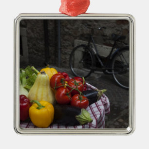 Italy, Brescia Province, Gargnano. Table with 2 Metal Ornament