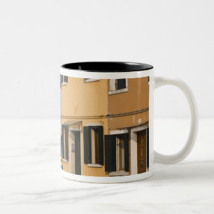 Italy, Burano. Colourful row of homes and empty Two-Tone Coffee Mug