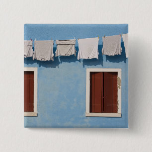 Italy, Burano. Hanging laundry and windows along 2 Inch Square Button