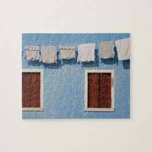 Italy, Burano. Hanging laundry and windows along Jigsaw Puzzle