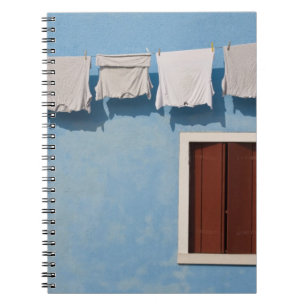 Italy, Burano. Hanging laundry and windows along Notebook