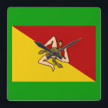 Italy - Sicily Flag Wall Clock<br><div class="desc">One can use this wall clock anywhere: in the home,  the office,  classroom,  dorm,  etc.  The clock contains the Sicilian flag on a bed of green. One may change the background colour if desired.</div>