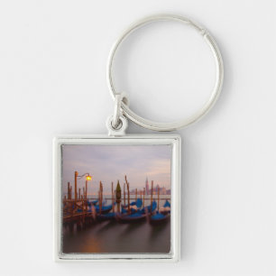 Italy, Venice. Anchored gondolas at twilight. Keychain