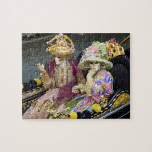 Italy, Venice. Couple dressed in costumes for Jigsaw Puzzle
