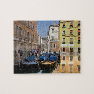 Italy, Venice, gondolas moored along canal Jigsaw Puzzle