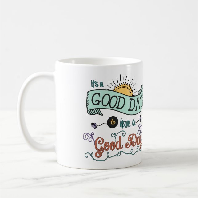 It's a Colourful Good Day Coffee Mug by Jan Marvin (Left)