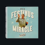 It's a Festivus Miracle Notebook<br><div class="desc">Gather 'round the aluminum pole and celebrate the most unexpected moments of the season with this "It's a Festivus Miracle!" graphic. Featuring the legendary Frank Costanza in his peak holiday form, this design captures the hilarious energy of the Seinfeld holiday we all know and love. With its retro sunburst background...</div>