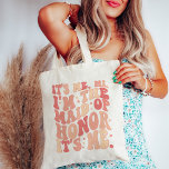 Its Me Hi Im the Maid Of Honour Its Me Personalize Tote Bag<br><div class="desc">Introducing the "It's Me Hi I'm the Maid of Honour" Personalized Tote Bag – the perfect blend of style and functionality for your esteemed Maid of Honour. This trendy and cute peach coral pink tote bag is not just an accessory; it's a statement piece that reflects the importance of your...</div>