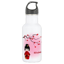 Japanese kokeshi doll at sakura blossoms