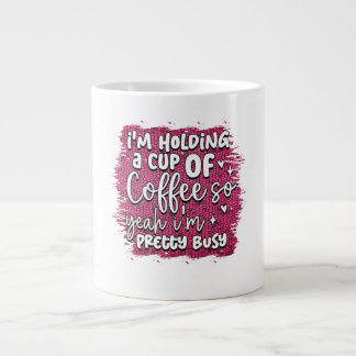 Je tiens une tasse de café, alors