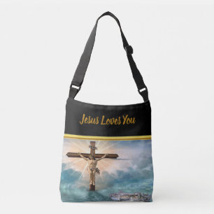 Jesus hanging from a christian crucifixion cross crossbody bag