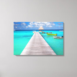 Jetty with boats in a tropical lagoon canvas print