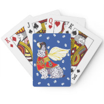 Cocker Spaniel tacheté jouant aux cartes