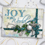 Jewelled Teal and Silver Holiday Card<br><div class="desc">Richly layered design in deep teal and silver featuring satin ribbons,  beads,  a silver filigree star,  diamond key,  silver ornament and holly. Text is embossed with a touch of glitter. Background is textured and distressed with twinkle highlights. Inside text is customizable. Matching products available.</div>