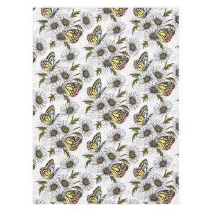 Jezebel butterflies and daisy flowers on white tablecloth