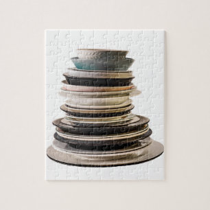Jigsaw puzzle of a stack of plates.