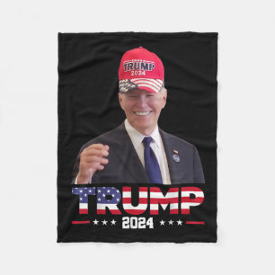 Joe Biden Wearing A Trump Hat 1  Fleece Blanket