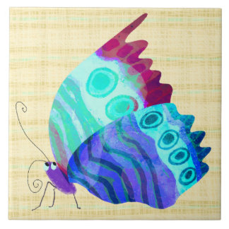 Joli papillon sur carreau en céramique bleu