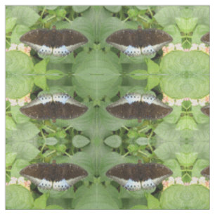 Joli tissu animal à motifs de papillons tropicaux