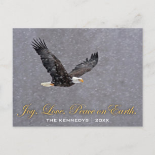 Joy Love Peace - Bald eagle flying in snowstorm Holiday Postcard