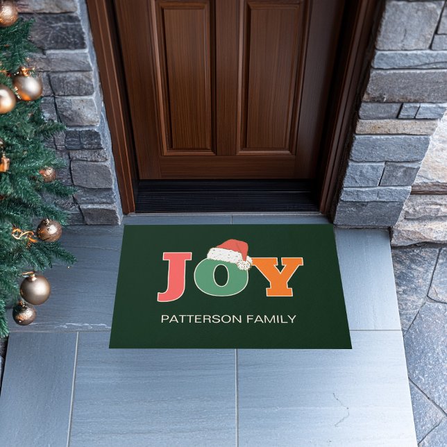 JOY! Santa Hat Script Typography Custom Family Doormat (Colorful, festive, typographic "JOY" santa hat, green, holiday door mat. Customize with your family )
