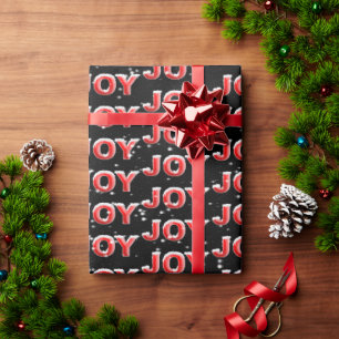 JOY text with snowflakes on black background Wrapping Paper