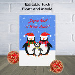 Joyeux Noel Bonne Annee penguins french language Holiday Card<br><div class="desc">A lovely French language card for your family and friends. This family of penguins are enjoying the winter season, wearing stripey scarves and christmas hats to keep warm as snowflakes are falling. The text on the front in red is fully customisable: "Joyeux Noël et Bonne Année". Snowflakes form a background...</div>