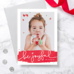 Joyful Brushstroke Holiday Photo Card<br><div class="desc">A modern holiday card featuring a festive red brushstroke and joyful script. The backer includes a snowy pattern with the option to remove and swap with a personalized message or additional photos.</div>