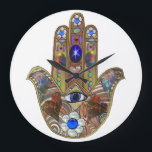 Judaica Hamsa Hearts Flowers Opal Art Print Large Clock<br><div class="desc">Whether worn as a piece of jewellery, displayed as an art piece, or used as a decorative element, the Hamsa with the third eye serves as a powerful reminder of the importance of spiritual growth, insight, and protection. It encourages individuals to open their minds and hearts to the unseen realms...</div>