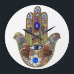Judaica Hamsa Hearts Flowers Opal Art Print Large Clock<br><div class="desc">Whether worn as a piece of jewellery, displayed as an art piece, or used as a decorative element, the Hamsa with the third eye serves as a powerful reminder of the importance of spiritual growth, insight, and protection. It encourages individuals to open their minds and hearts to the unseen realms...</div>