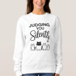 JUDGING YOU Silently Sweatshirt<br><div class="desc">Four cute cartoon cats. It blends sarcasm and charm,  perfect for cat lovers with a witty side.
It's a playful way for the wearer to show off personality—sarcastic,  observant,  and fond of cats.
Design Note: For custom requests,  message me at daed.halabi@gmail.com. 😊</div>