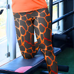 Jungle Giraffe Print Leggings<br><div class="desc">These leggings are beautifully designed with a mesmerizing orange and black giraffe spots pattern, offering a unique and stylish addition to your wardrobe. The pattern showcases the distinctive and elegant spots that are characteristic of giraffes, creating a sophisticated and eye-catching look. The leggings are made from high-quality and stretchy fabric,...</div>