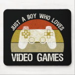 Just A Boy Who Loves Video Games Mouse Pad<br><div class="desc">Just A Boy Who Loves Video Games. This funny gamer accessory is a great gift for a man, boy, teens & kids who love playing video games & computer games. If you're a geek and love console games & computer gaming, this design is for you! Includes a graphic of a...</div>