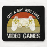 Just A Boy Who Loves Video Games Mouse Pad<br><div class="desc">Just A Boy Who Loves Video Games. This funny gamer accessory is a great gift for a man, boy, teens & kids who love playing video games & computer games. If you're a geek and love console games & computer gaming, this design is for you! Includes a graphic of a...</div>