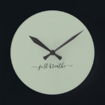 Just breathe green elegant script yoga  round clock<br><div class="desc">Modern yoga clock with a chic sage green background and an elegant hand lettered black script with the quote "just breathe".</div>