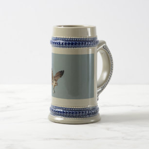 Juvenile Osprey in flight Beer Stein